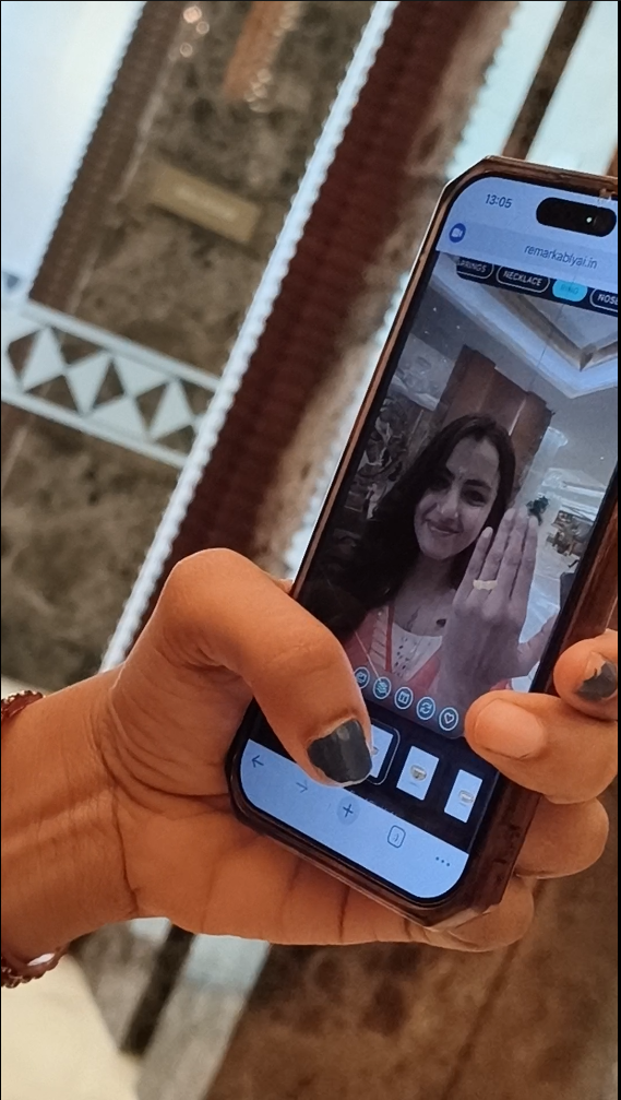 Influencer trying a RemARkablyAI ring virtual try-on experience at a jewellery expo